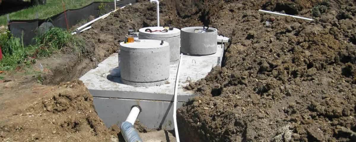 Septic system repair and installation site with tank access ports in Plymouth, MA
