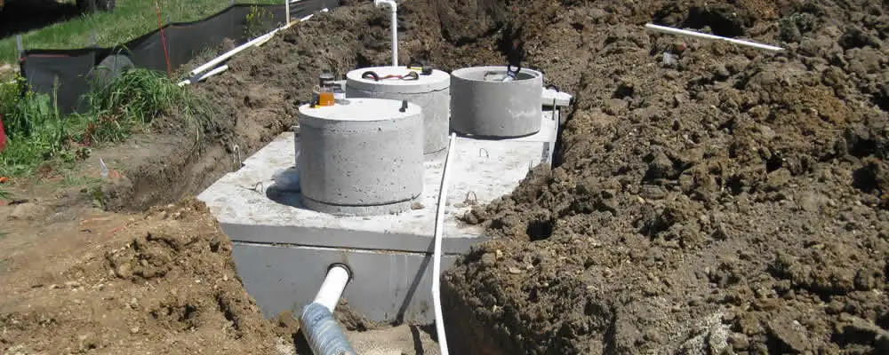 Septic system repair and installation site with tank access ports in Plymouth, MA
